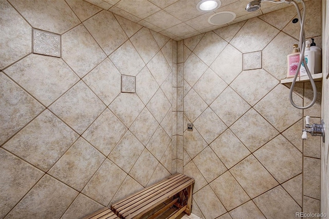 bathroom with a tile shower