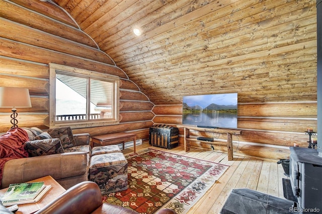 living room with hardwood / wood-style flooring, lofted ceiling, log walls, and wooden ceiling