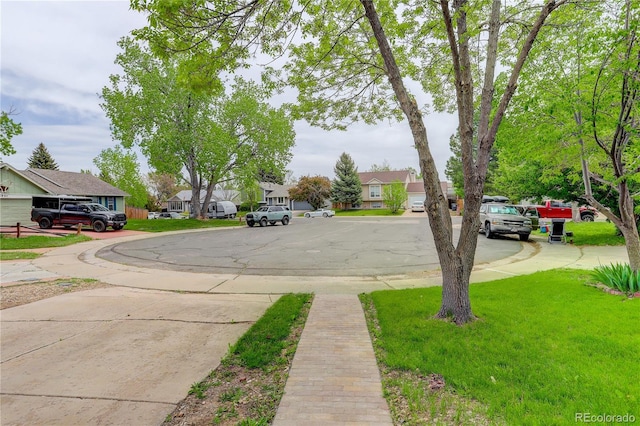 view of road with a residential view and sidewalks