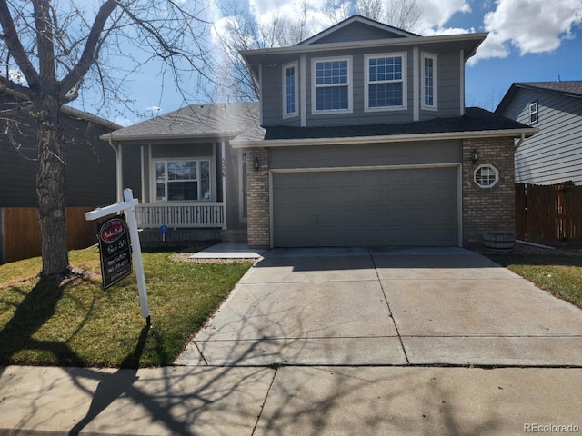 view of front of house with driveway, brick siding, fence, and a garage