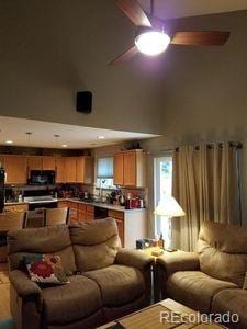 living area with a ceiling fan
