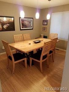 dining room featuring baseboards and wood finished floors