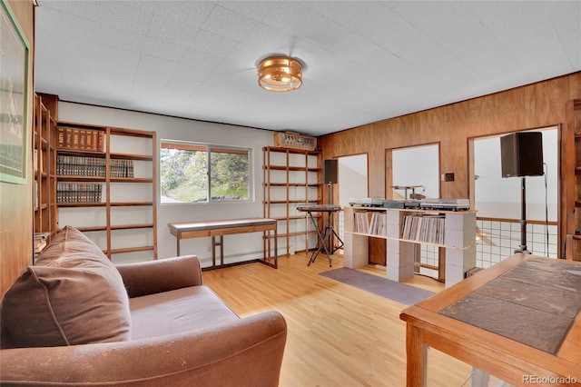 9648 Yegge Rd, Morrison, CO 80465 - living area featuring wood walls and wood finished floors
