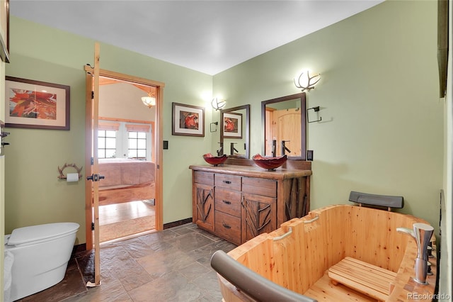 9648 Yegge Rd, Morrison, CO 80465 - bathroom with double vanity and stone finish floors