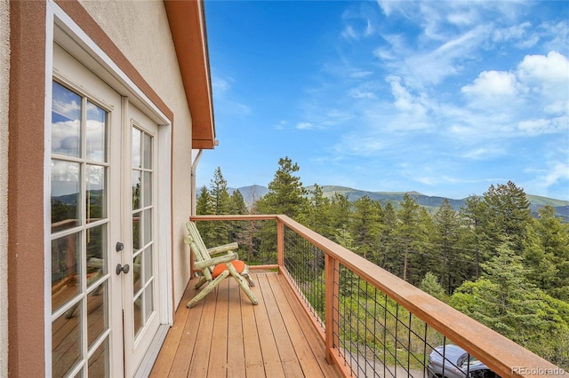 9648 Yegge Rd, Morrison, CO 80465 - balcony featuring a mountain view, a forest view, and french doors