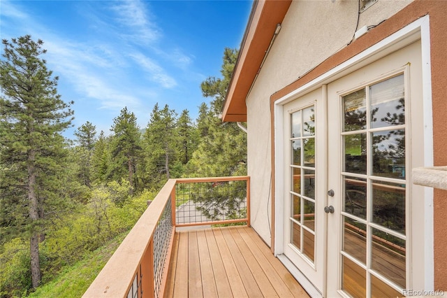 9648 Yegge Rd, Morrison, CO 80465 - deck featuring french doors and a forest view