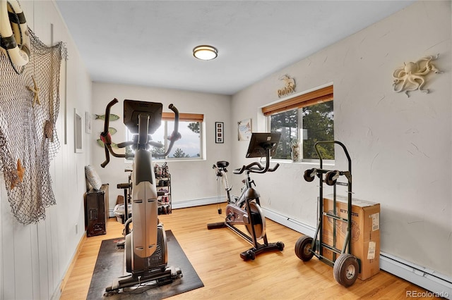 9648 Yegge Rd, Morrison, CO 80465 - exercise area featuring a baseboard radiator, wood finished floors, and baseboard heating
