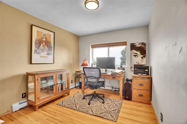 9648 Yegge Rd, Morrison, CO 80465 - office space with a baseboard heating unit and wood finished floors