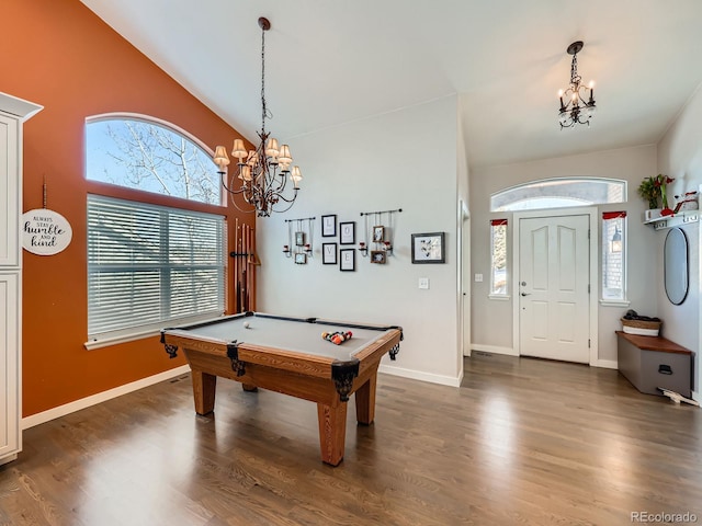 recreation room with lofted ceiling, a notable chandelier, dark hardwood / wood-style flooring, and billiards