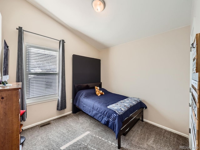 bedroom with lofted ceiling and carpet flooring