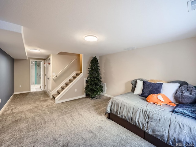 carpeted bedroom with ensuite bath