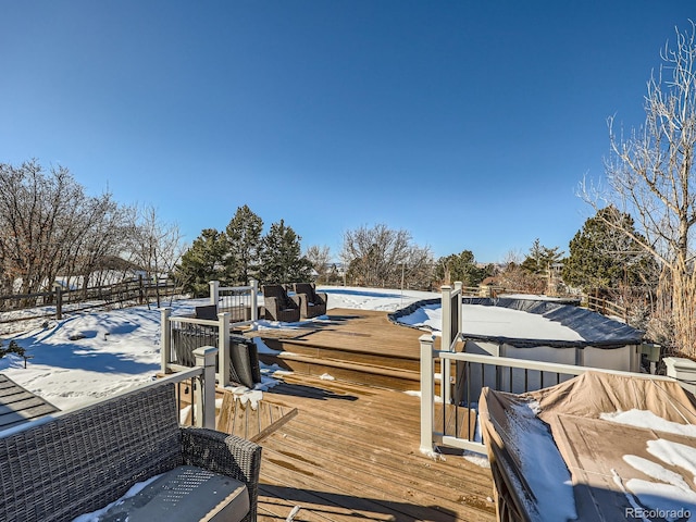 view of snow covered deck