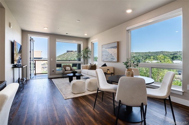 dining area featuring dark wood-style floors, recessed lighting, and baseboards