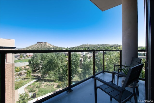 balcony featuring a mountain view