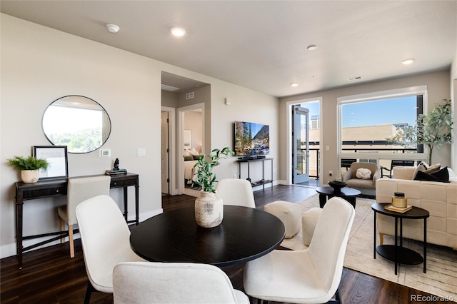 dining area featuring dark wood-style floors, recessed lighting, and baseboards