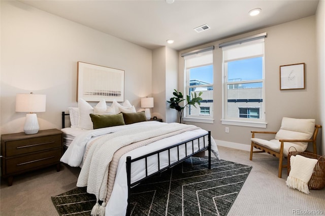 bedroom with visible vents, dark carpet, baseboards, and recessed lighting