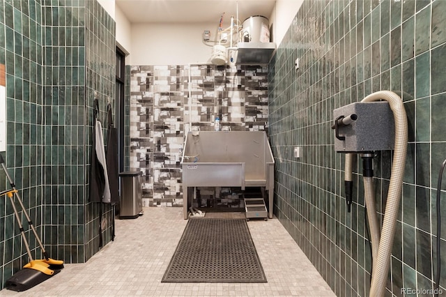 20 Wilcox St Unit 410, Castle Rock, CO 80104 - bathroom featuring tile walls and a tile shower