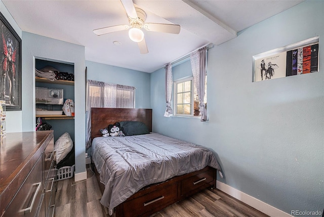 bedroom featuring a ceiling fan, dark wood finished floors, and baseboards