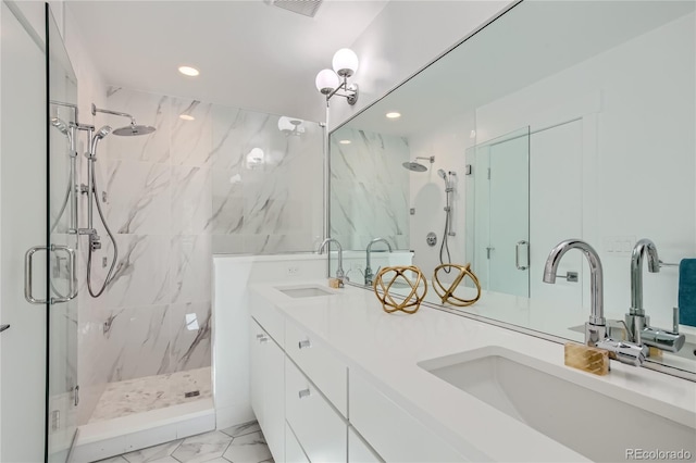 bathroom featuring vanity and an enclosed shower