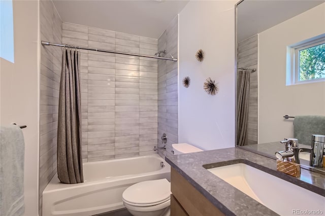 full bathroom with shower / bath combo, vanity, and toilet