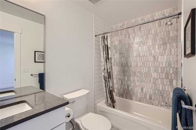 full bathroom featuring shower / bath combo with shower curtain, vanity, and toilet