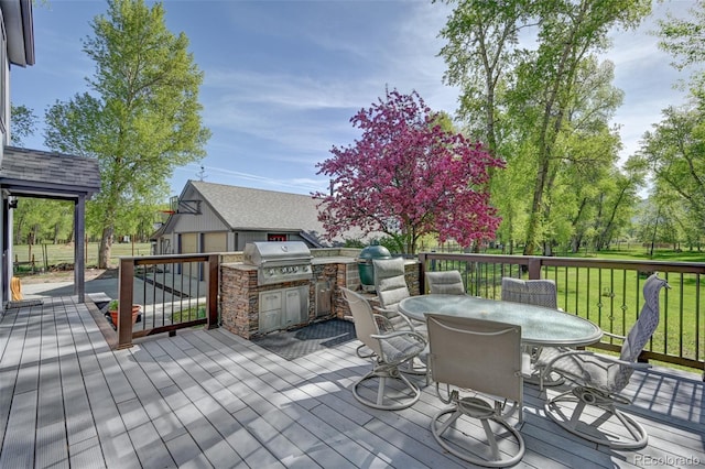 29250 County Road 330, Buena Vista, CO 81211 - deck with grilling area, an outbuilding, outdoor dining space, and a lawn