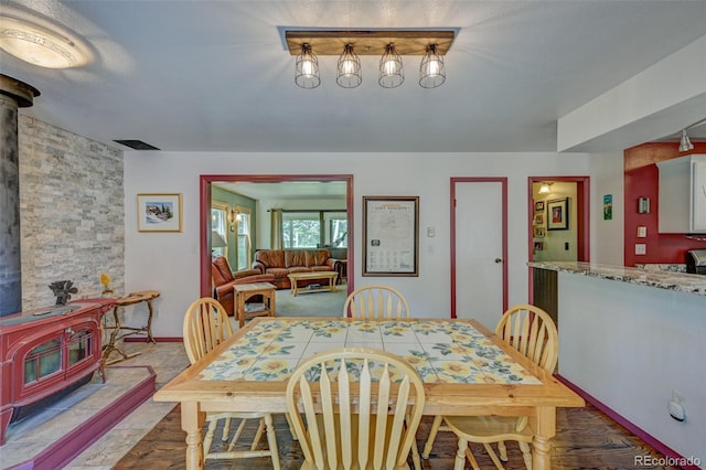 29250 County Road 330, Buena Vista, CO 81211 - dining space with a wood stove and baseboards