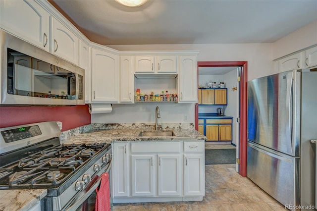 29250 County Road 330, Buena Vista, CO 81211 - kitchen featuring appliances with stainless steel finishes, white cabinetry, and light stone countertops