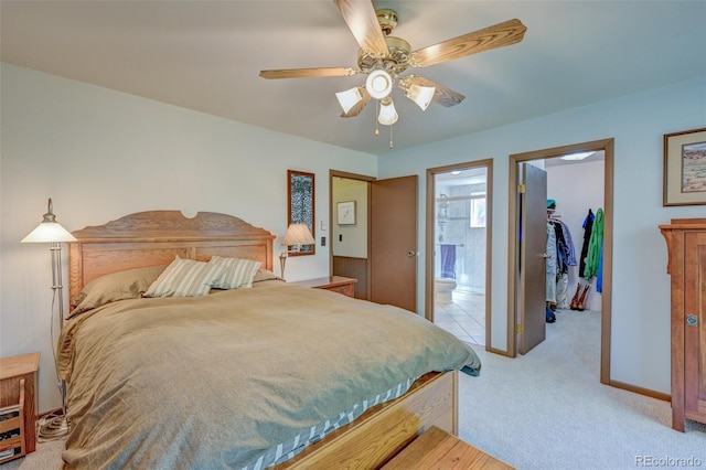 29250 County Road 330, Buena Vista, CO 81211 - bedroom with a spacious closet, light carpet, a closet, ensuite bathroom, and ceiling fan