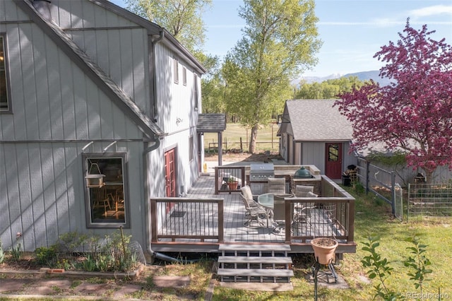 29250 County Road 330, Buena Vista, CO 81211 - wooden deck featuring outdoor dining area and a storage unit