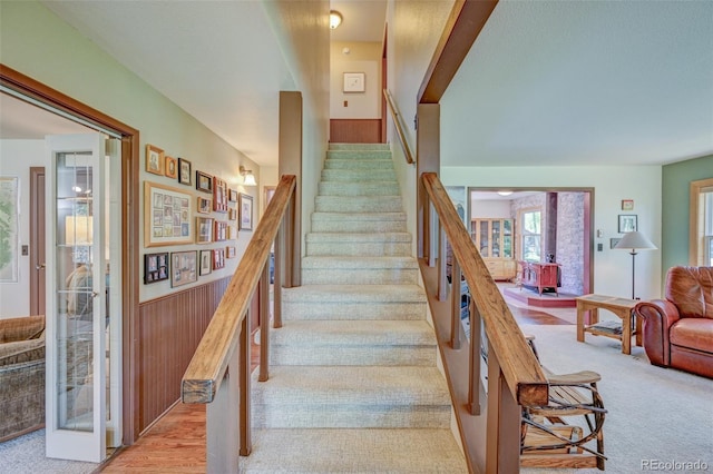 29250 County Road 330, Buena Vista, CO 81211 - stairway with carpet flooring, wainscoting, and wood walls