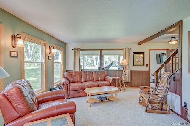 29250 County Road 330, Buena Vista, CO 81211 - carpeted living area with wainscoting, stairs, and wood walls