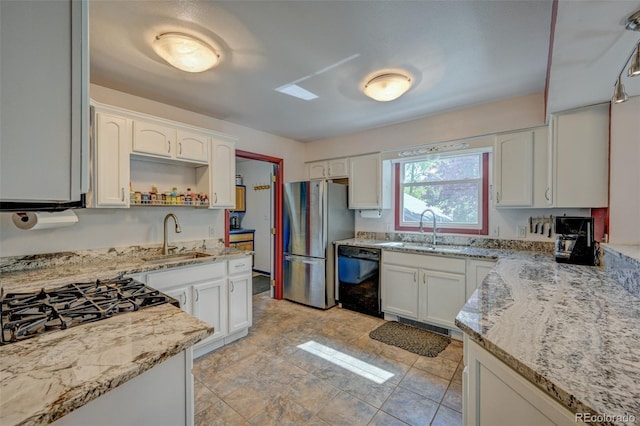 29250 County Road 330, Buena Vista, CO 81211 - kitchen with freestanding refrigerator, black dishwasher, white cabinetry, light stone counters, and open shelves
