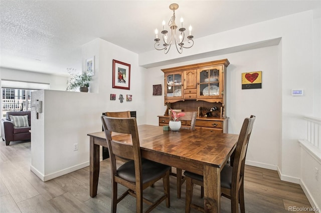 588 Beauprez Ave, Lafayette, CO 80026 - dining room with wood finished floors and a chandelier