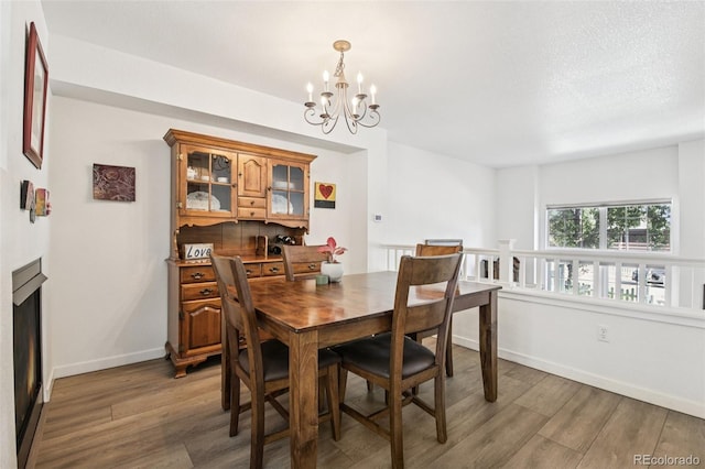 588 Beauprez Ave, Lafayette, CO 80026 - dining area featuring wood finished floors and a chandelier