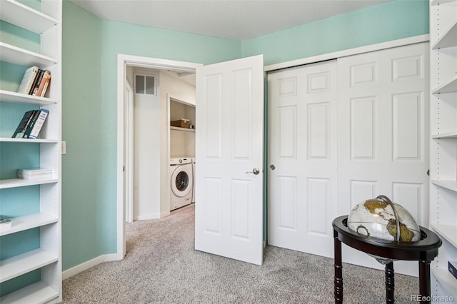 588 Beauprez Ave, Lafayette, CO 80026 - bedroom with light carpet, washer and dryer, and a closet