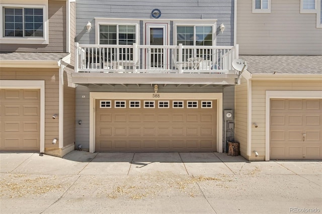 588 Beauprez Ave, Lafayette, CO 80026 - view of front of property with a balcony, a garage, and a shingled roof