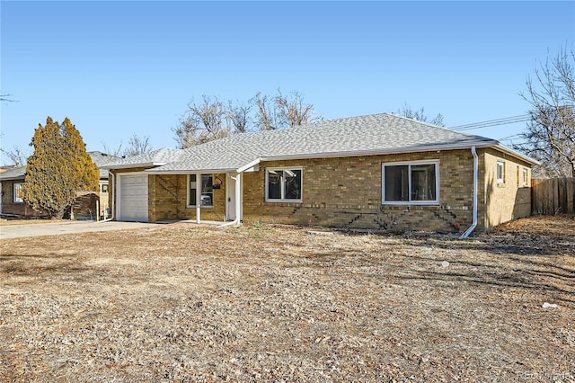 single story home featuring a garage