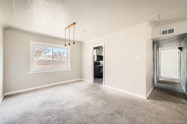 unfurnished room featuring carpet flooring