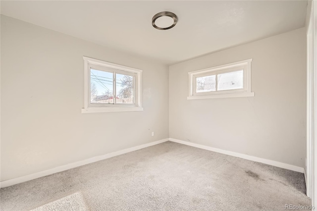 spare room with a healthy amount of sunlight and carpet floors