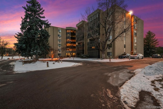 view of outdoor building at dusk