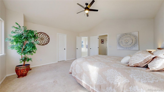 carpeted bedroom featuring ceiling fan and lofted ceiling