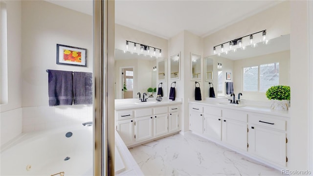 bathroom featuring a bathing tub and vanity