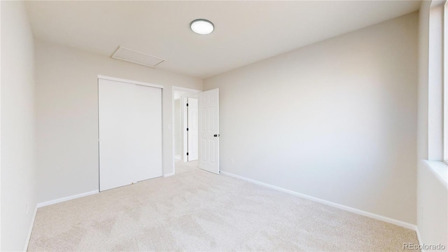 empty room with light colored carpet