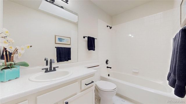 full bathroom with vanity, toilet, and tiled shower / bath