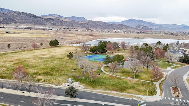 birds eye view of property featuring a water and mountain view