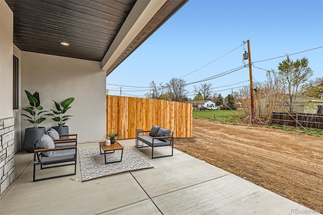 view of patio / terrace with fence and an outdoor living space