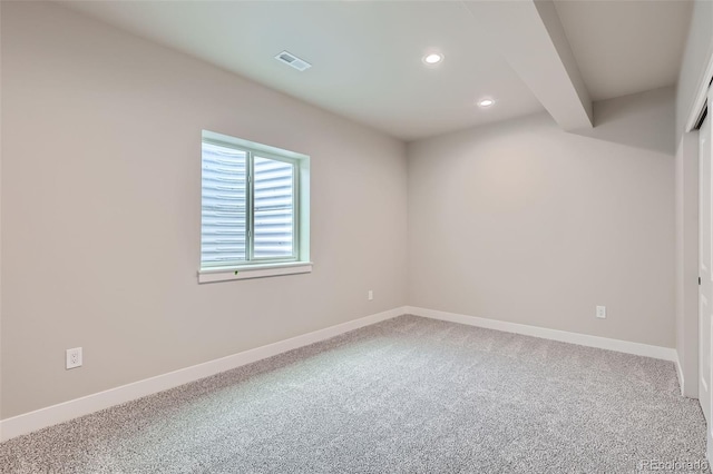 spare room featuring visible vents, carpet flooring, baseboards, and recessed lighting