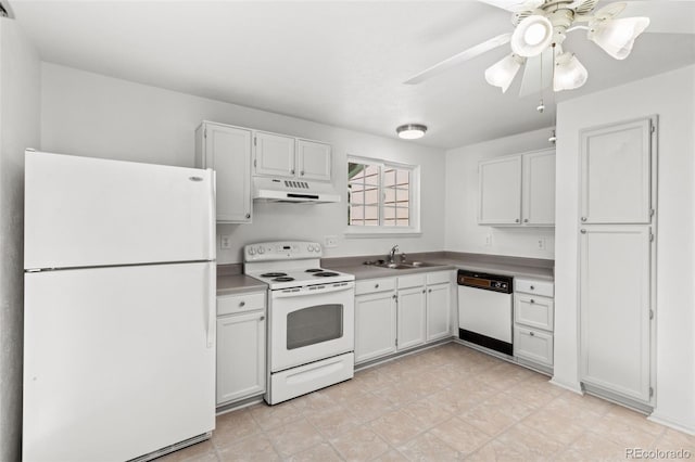 kitchen featuring white appliances, white cabinets, a sink, and under cabinet range hood