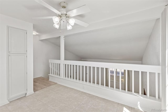 bonus room with lofted ceiling, ceiling fan, and light floors